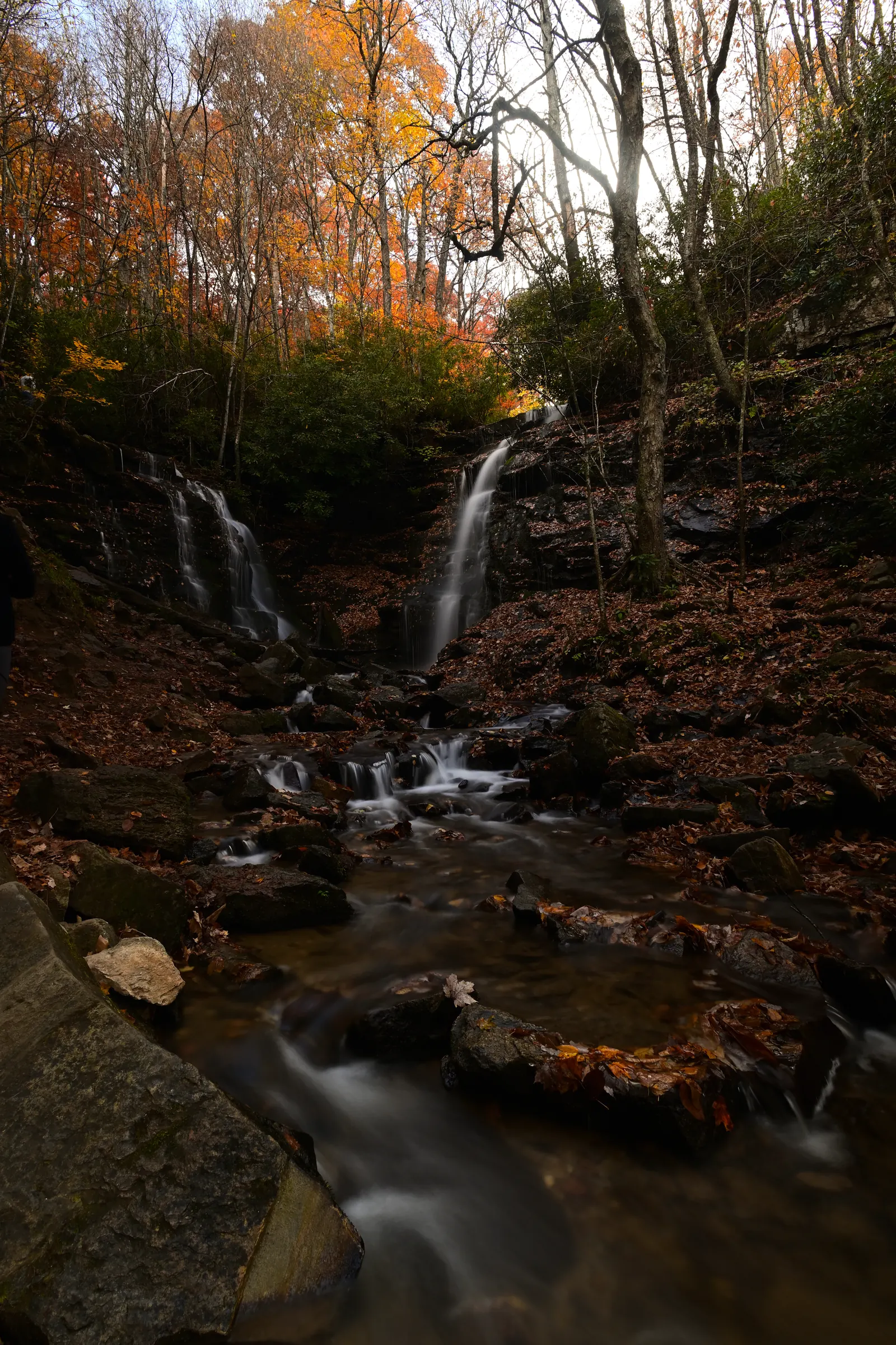 Soco Falls surrounded by autumn foliage between Maggie Valley and Cherokee