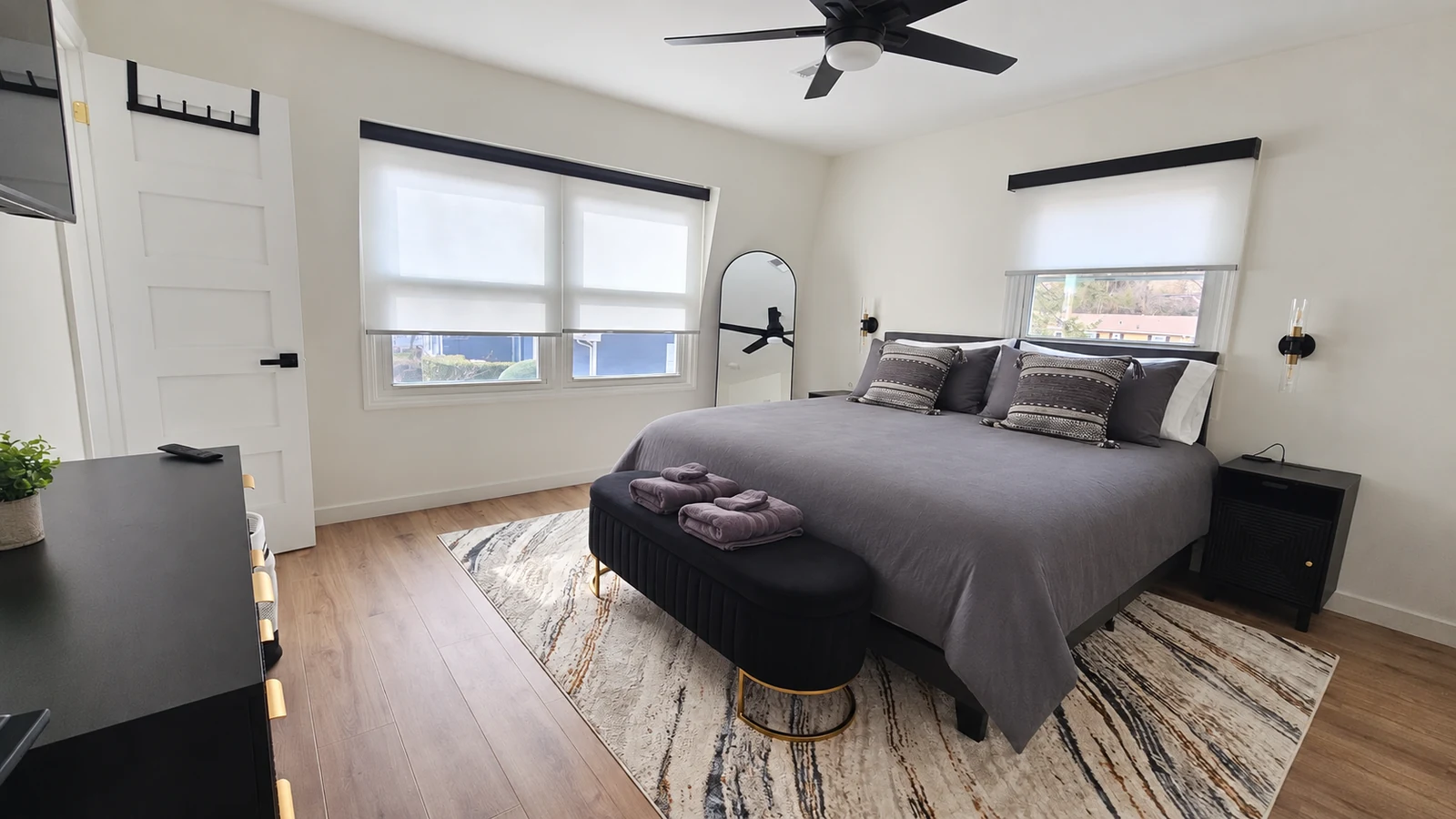 Royal Suite king bedroom with wall sconces and ensuite bath
